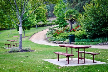 A bench in a park. 