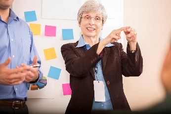 A teacher teaching Auslan. 