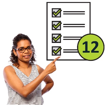 Woman pointing at a goals document with the number 12.