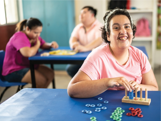 A group of Autistic people taking part in activities.