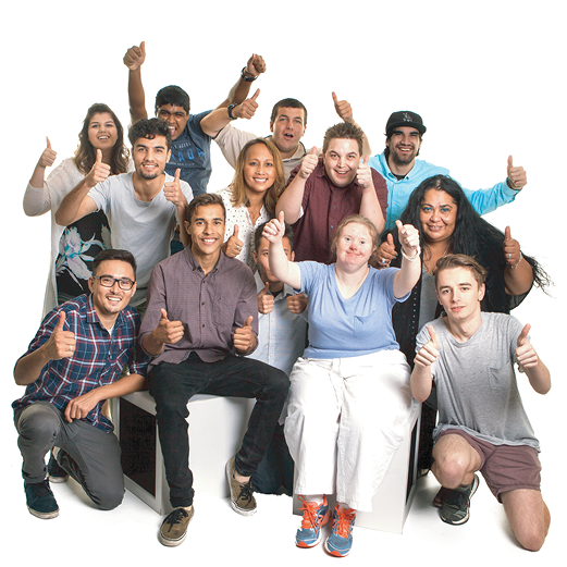 A large and diverse group of people giving a thumbs up.