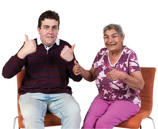 An Autistic person and another person with their thumbs up.