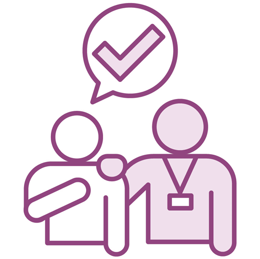 A person is being supported by a worker. They have a speech bubble showing a tick.